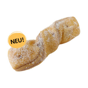 Ein Haselnusscreme Twisty, bestreut mit feinem Zucker und einem gelben Störer mit der Aufschrift 'NEU!'